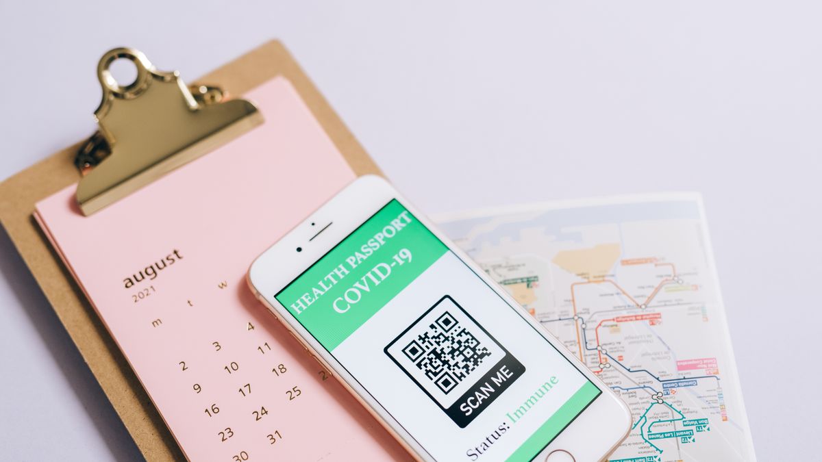 Smartphone with health passport and calendar for organized travel planning.